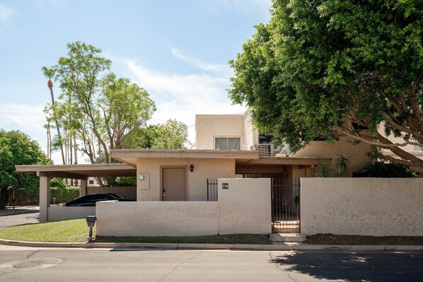 This charming established community is lush with plants and trees.
