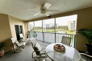 Relax on the screened in balcony