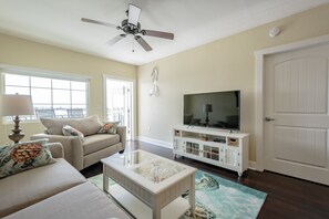 The Living room opens up to the unit's private balcony