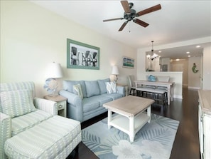 View from balcony - sleeper sofa and flat screen TV, living room has opens up to the balcony where you have amazing views of the Intracoastal.