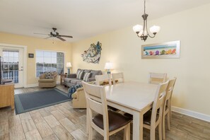 The Living room opens up to the unit's private balcony