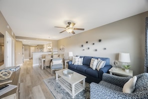 Living Area, and Dining Area (table seats 6)