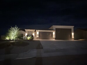 Front yard with full landscape lighting on timer