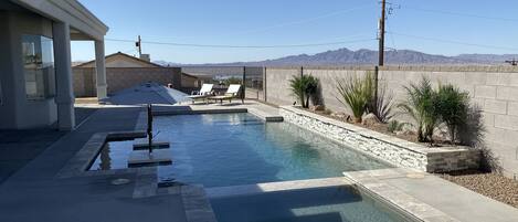 Heated pool and spa with Baja shelf and dual margarita tables