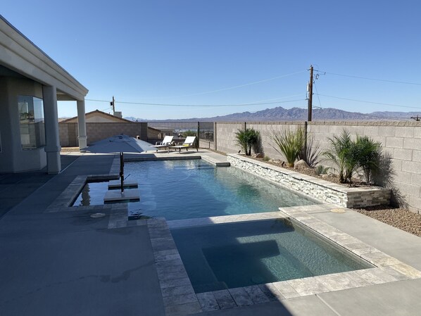 Heated pool and spa with Baja shelf and dual margarita tables