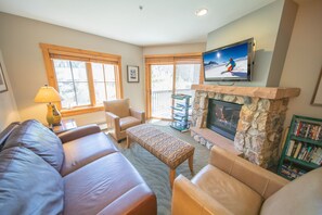 Stone gas fireplace and large TV
