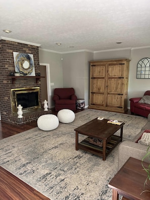 Cozy living room features a full size Murphy bed