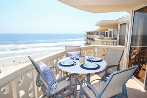 Gather around the patio table and watch as the tide rolls in