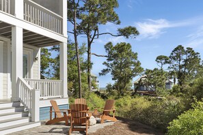 Backyard Fire Pit with Distant Beach View