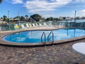 Relax at the pool in the sun loungers and enjoy beautiful water views.