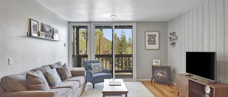 Comfortable Living Room with a Flat Screen TV and Electric Fireplace