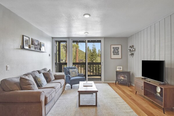 Comfortable Living Room with a Flat Screen TV and Electric Fireplace