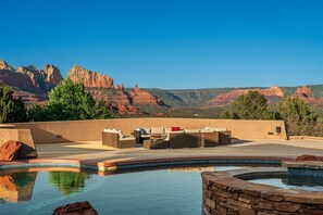 A beautiful double negative edge pool is perched for ultimate mountain views