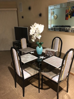 Large living room with two couches and Dining Table.