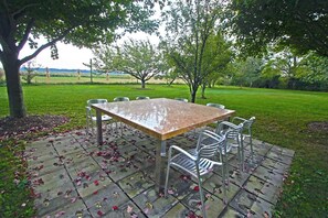 Outdoor dining with view of the nearby farm