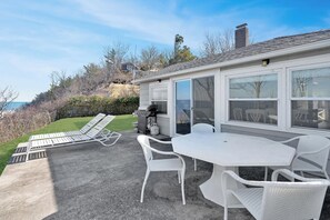 Alfresco dining and lounge chairs to relax and enjoy the view