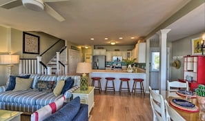 The main room consisting of a living room, dining area, and kitchen.