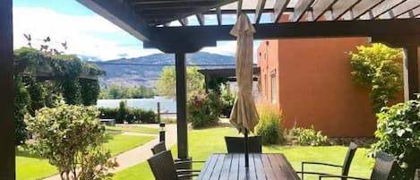 Pergola covered Patio facing Lake Osoyoos with  6-seater table.
