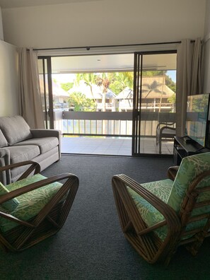Living room, looking out to lanai.