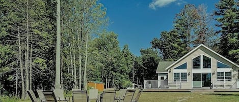 Fire pit area between the home & the lake