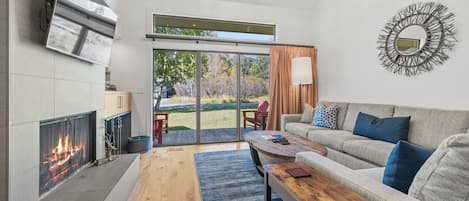 Living Room with Wood Fireplace and TV