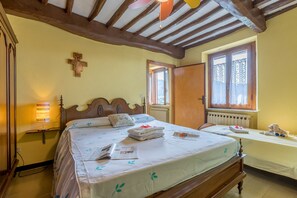 View of the master bedroom with extra single bed