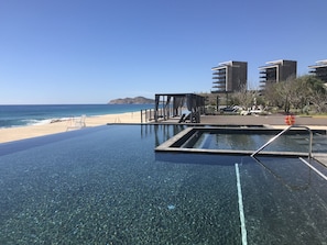 infinity pools with cabanas and swim up bar