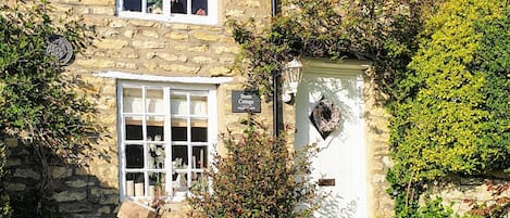 Beautiful 18th Century Listed Stone Cottage front garden.