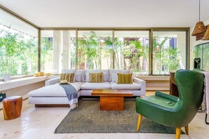 Living area with large windows to let you feel both indoors and out!