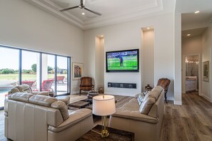 Living room with 82" HDTV and 72" linear gas fireplace