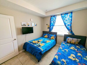 Minion-themed guest room with beds for kids.