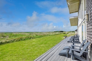 Brand new front deck with stunning ocean views and 6 Adirondack chairs.