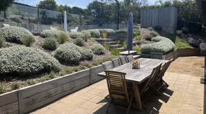 Outdoor dining then stairs  to pool area