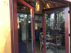 French doors open to the living area of the cabin.