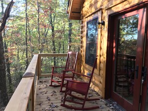 Enjoy the view of the woods and the fire pit below.  