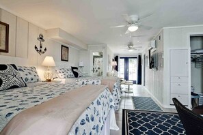 2 comfortable queen -size beds with new bed linens to unwind after beach time.  LED television. 