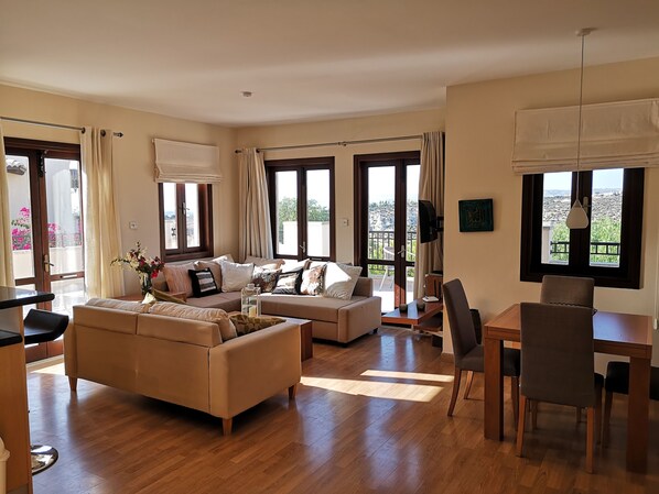 spacious living room with open space kitchen, direct access to the big terrace
