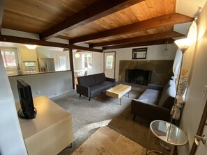 Living room with wood burning fireplace