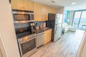 Full Sized Modern Appliances in Kitchen Area