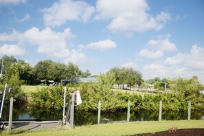 Backyard with river view, boat list, dock