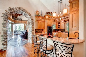 Wrought Iron, Rock, and Wood describe the Flowing Floorplan Room to Room 