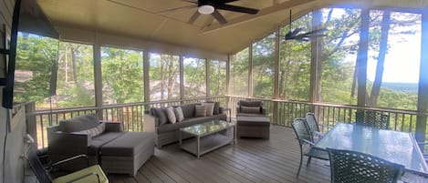 Newly Renovated Covered Porch with TV, lounge furniture, fans, & safety railings