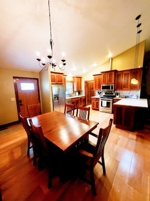 Dining table expands to seat more family. Extra chairs in the master closet.