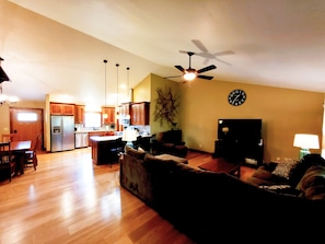 Large sectional and lazy boy recliner, large TV with Dish Network.