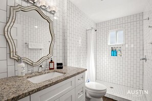 Full bathroom with the essentials plus shampoo, conditioner, and body wash