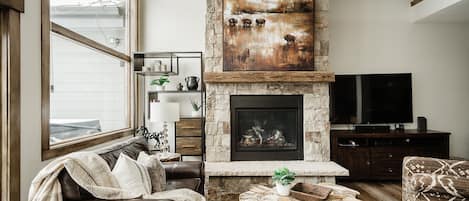 Cozy up to the fireplace in the family room after a day on the mountain