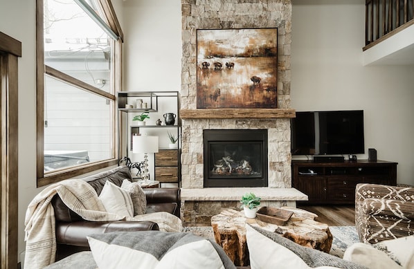 Cozy up to the fireplace in the family room after a day on the mountain