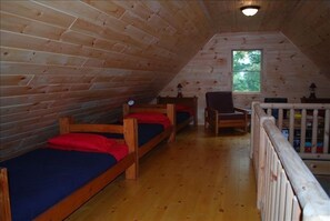 sleeping loft and tv viewing area