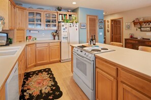 Kitchen with refrigerator, oven, and dishwasher