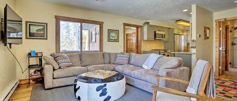 Curl up on the sofa after an adventurous day near this vacation rental cabin!
